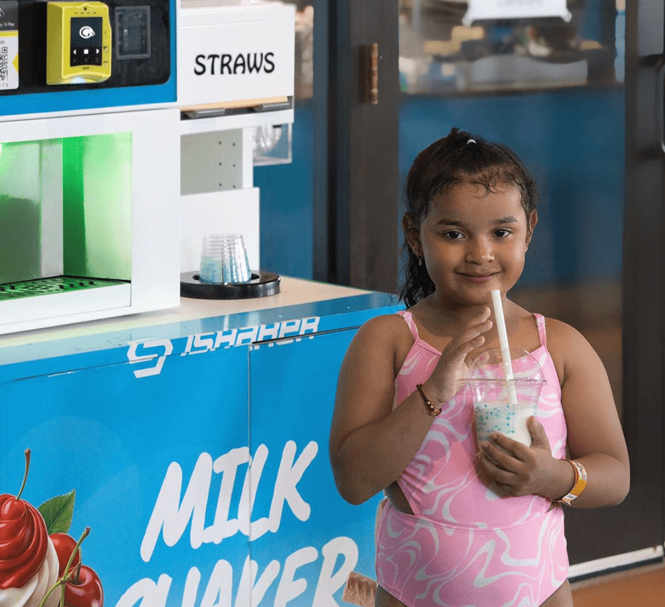 Child using iShaker machine